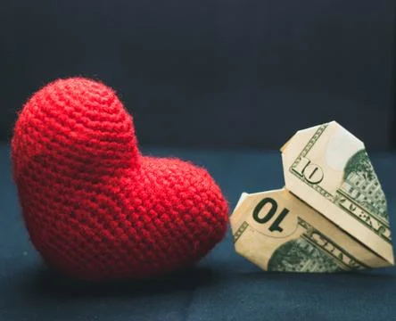 Two hearts on a black background Stock Photos