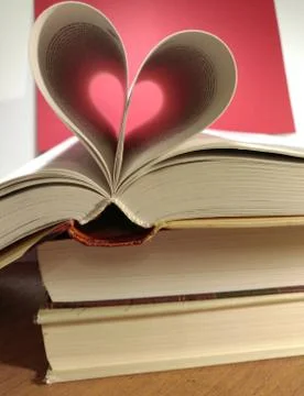 Two hearts on books. Stock Photos