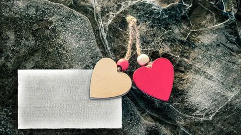 Two hearts on broken ice. Tablet for text. Mockup. Valentine's Day. Stock Photos