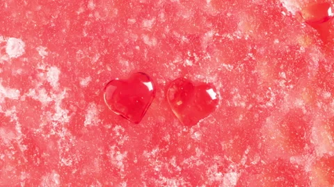 Two hearts in the melting snow Stock Footage 147373997