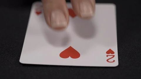 Two of hearts playing card, moving on a luxury black background 4k Stock Footage 95418943