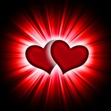 Two hearts with rays on a black Stock Photos