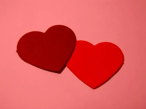 Two hearts in red Stock Photos