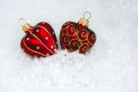 Two hearts in snow Stock Photos