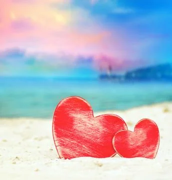 Two hearts on the summer beach Stock Photos
