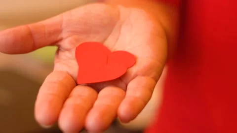 Two hearts in a woman's hand 4K Stock-Footage 102439835