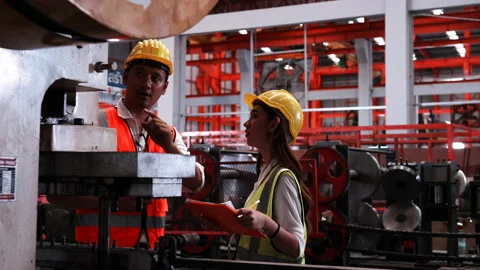 Two heavy industrial engineers check together in a steel factory. Stock Footage 173369755