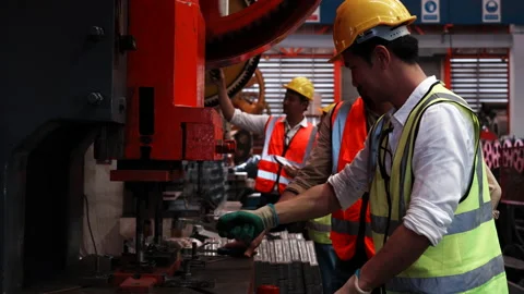 Two heavy industrial engineers check together in a steel factory.  Stock Footage 173370177