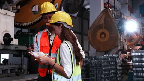 Two heavy industrial engineers check together in a steel factory. Stock Footage 173370317