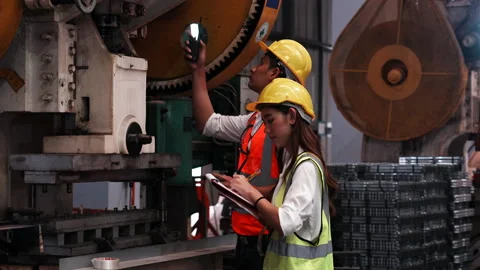 Two heavy industrial engineers check together in a steel factory. Stock Footage 173372162