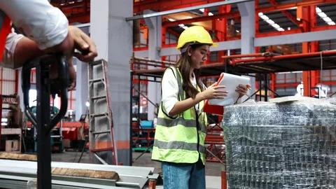 Two heavy industrial engineers check together in a steel factory.  Stock Footage 173386125
