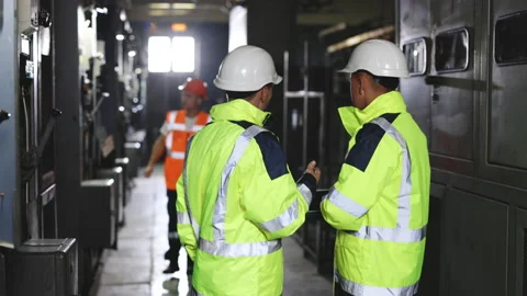 Two Heavy Industry Engineers Stand in Pipe Manufacturing Factory, Use Digital Stock Footage 194627813