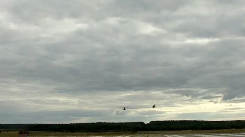Two helicopter fly out from base Stock-Footage 1075553