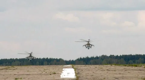 Two helicopter take of air-field Stock Footage 1075559