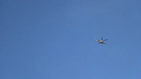 Two helicopters attack ISIL targets at Fallujah, Iraq Stock Footage 149349722