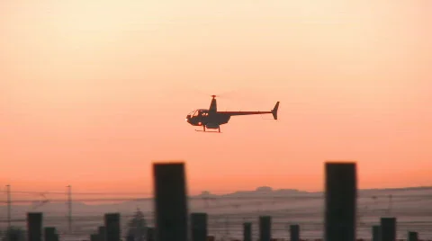 Two helicopters going different directions Stock Footage 533847