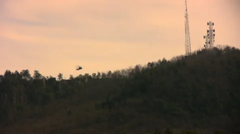 Two helos over the mountain Stock Footage 1104305