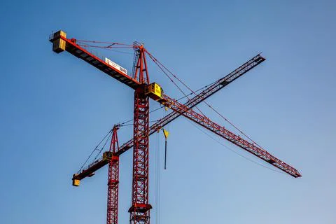 Two high cranes at Construction of fourth bridge across river Ob in Novosibir Stock Photos