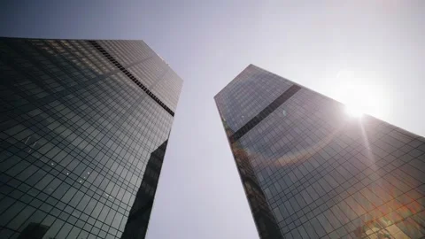 Two high-rise buildings are illuminated by the rays of the sun Stock Footage 308870586