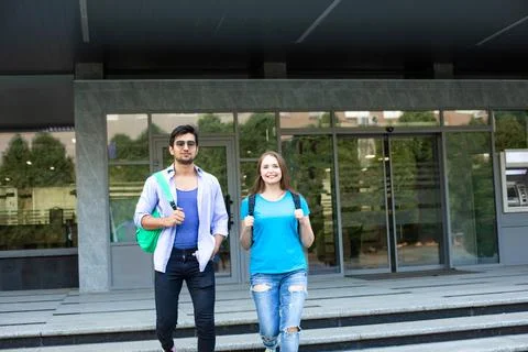 Two high school students leave the building Fotos de archivo