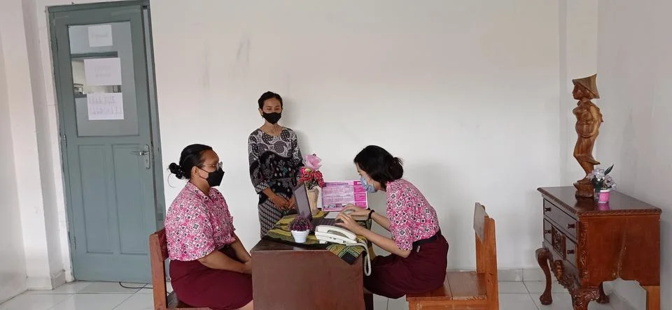 Two high school students practicing speaking English in a classroom in Indonesia Stock Photos