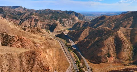 Two highways among the spectacular canyons. Hot dry deserted rocky area Stock Footage 317816867
