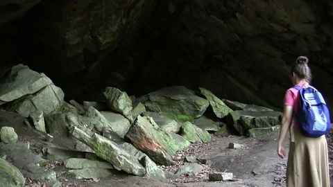 Two Hikers Check out Cave Video stock 76469050