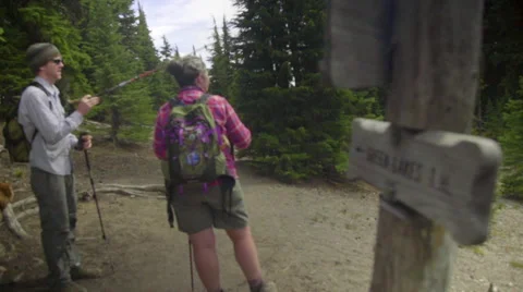 Two hikers decide where to go next Stock Footage 59063340