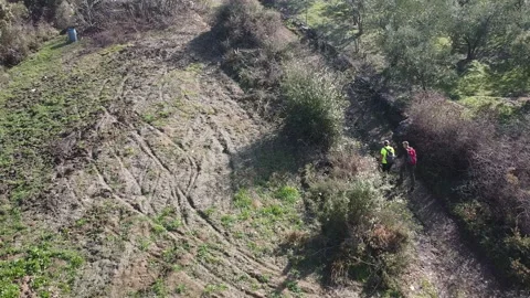 Two hikers explore the serene landscape Stock Footage 326117034