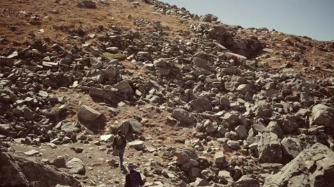 A two hikers exploring  mountain Bhrigu lake, Manali, Himachal Pradesh, India Stock Footage 333112768