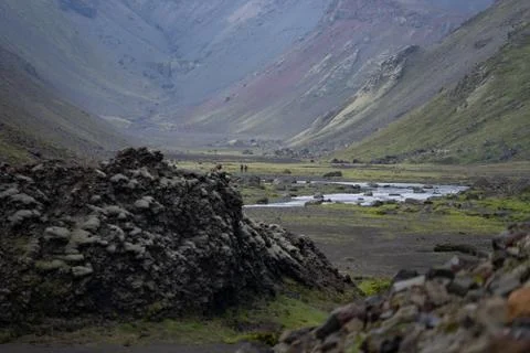 Two hikers going through Eldgja canyon covered with moss in Iceland highlands Stock Photos