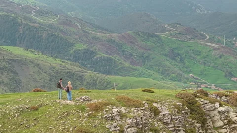 Two Hikers Overlooking Green Pyrenees Valley Stock Footage 345265375
