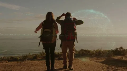 Two hikers reaching overlook, adjusting packs, activating circle waveform, Stock Footage 334203608