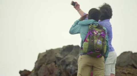 Two hikers take a selfie Stock Footage 59516415