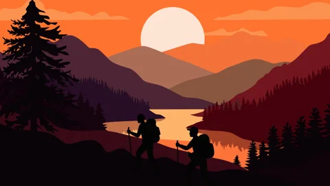 Two Hikers Trekking by Mountain Lake at Sunset 库存影片 333967553