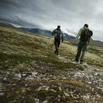 Two hikers walking Stock Photos