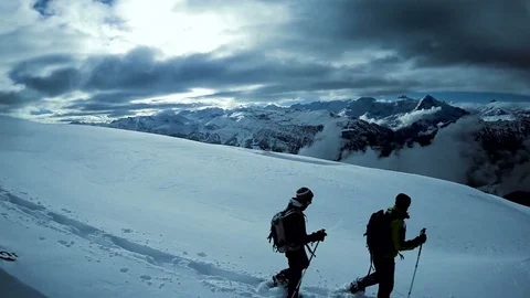 Two hikers walking on snow mountain landscape. outdoors adventure trip Stock Footage 72878538