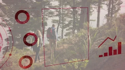 Two hikers walking uphill on trail, red globe sliding in framing them charts Stock Footage 333602761