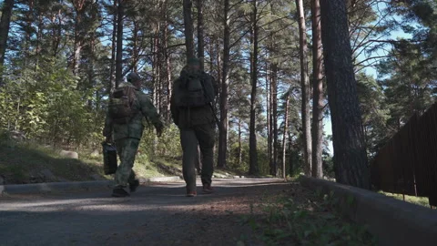 Two hikirs with backpacks go to the forest Stock Footage 160437352
