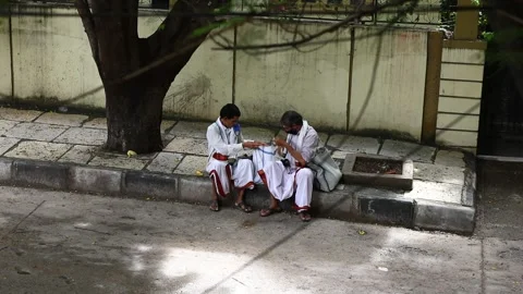 Two-hindu-priests-on-sidewalk 스톡 동영상 137839508