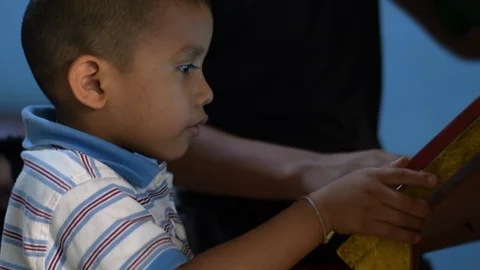 Two hispanic children playing games on tablet in Santa Rosa Guatemala Stock Footage 121924589