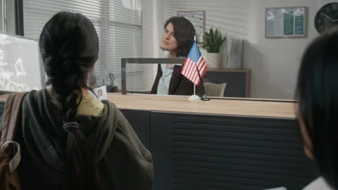Two Hispanic Women Checking Application Forms before Applying for USA Visa Stock Footage 331514974