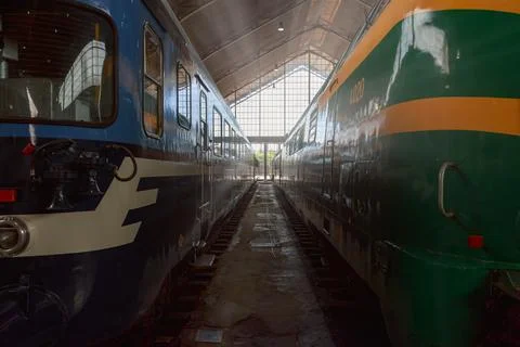 Two historic trains displayed inside a railway museum in Madrid, Spain Stock Photos