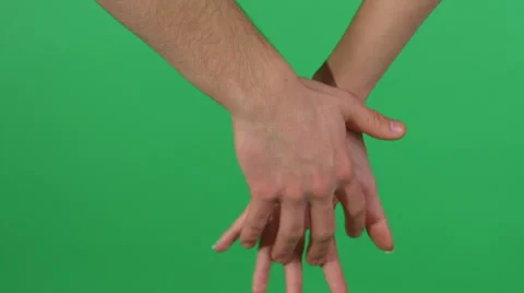 Two holding hands on green screen background, male hand in front HD Stock-Footage 46366996
