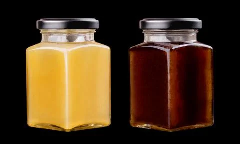 Two honey jars Stock Photos