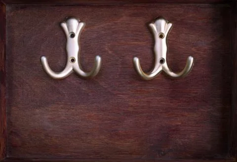 Two hooks into dark box Stock Photos