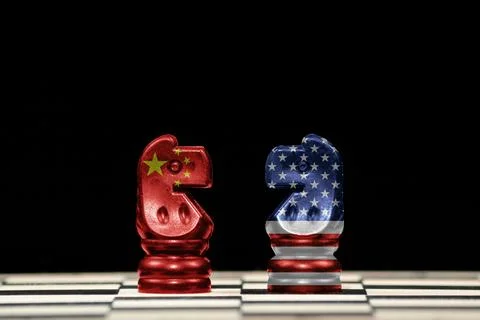 Two horses chess pieces with the flags of china and united states over a ches Stock Illustration