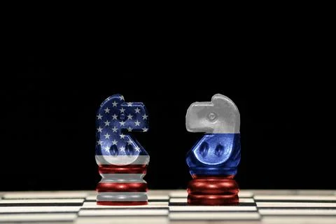 Two horses chess pieces with the flags of united states and russia over a che Stock Illustration