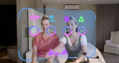 Two hosts hosting beauty tutorial tapping dashboard icons as metrics update Vídeo Stock 320416104