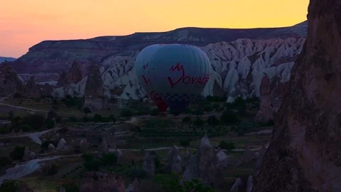 Two hot air baloons fire up for take off Stock Footage 69949016